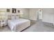 Comfortable bedroom with neutral color scheme, carpet floors, and bright natural light at 10437 River Bream Dr, Riverview, FL 33569