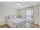 Bedroom with natural light, carpet floors, window and neutral paint and white decor at 10437 River Bream Dr, Riverview, FL 33569