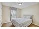 Bedroom featuring window with decorative sheer curtains and carpet floors at 10437 River Bream Dr, Riverview, FL 33569