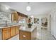 Open kitchen with a functional island, modern appliances, and a seamless flow to the dining area at 10437 River Bream Dr, Riverview, FL 33569