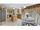 Bright kitchen featuring a center island, ample cabinetry, and a cozy breakfast nook at 10437 River Bream Dr, Riverview, FL 33569