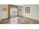 Spacious room with vinyl flooring, crown molding, and decorative window treatments at 10437 River Bream Dr, Riverview, FL 33569