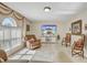 Comfortable living room with neutral walls, tile flooring, and an abundance of natural light at 10437 River Bream Dr, Riverview, FL 33569