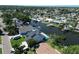 Waterfront homes with private docks and lush greenery on a sunny day provide relaxation and luxury at 10729 Drummond Rd, Tampa, FL 33615