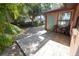 Backyard features a patio area with two chairs at 10729 Drummond Rd, Tampa, FL 33615