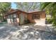 Cozy backyard featuring a paved patio area with outdoor seating and lush tropical surroundings at 10729 Drummond Rd, Tampa, FL 33615