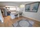 Bright kitchen features stainless steel appliances, granite countertops, breakfast bar, and modern chandelier at 10729 Drummond Rd, Tampa, FL 33615