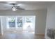 Cozy living room featuring hard wood floors, a fireplace and large windows at 10729 Drummond Rd, Tampa, FL 33615