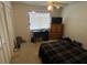 Comfortable bedroom with a window, desk, television and closet, offering a peaceful and organized living space at 110 Lakeside Ct # 110, Oldsmar, FL 34677