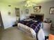 Bedroom featuring a comfortable bed, ceiling fan, and natural light; perfect for a peaceful retreat at 110 Lakeside Ct # 110, Oldsmar, FL 34677