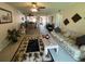 Inviting living room featuring comfortable seating, neutral carpet, and a charming palm tree design area rug at 110 Lakeside Ct # 110, Oldsmar, FL 34677
