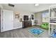 A playful bedroom with a bunk bed, TV and sports themed rug at 11002 Sundrift Dr, Tampa, FL 33647