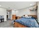 Bedroom featuring laminate floors, gray walls, light fixture, and a wooden bed frame at 11002 Sundrift Dr, Tampa, FL 33647