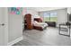 Bedroom featuring a bunkbed, gray walls and vinyl flooring at 11002 Sundrift Dr, Tampa, FL 33647
