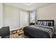 Cozy bedroom with a dark-colored bed, modern bedding, and a large closet for storage at 11002 Sundrift Dr, Tampa, FL 33647