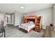 Bedroom featuring a bunkbed, gray walls and vinyl flooring at 11002 Sundrift Dr, Tampa, FL 33647
