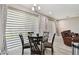 Bright dining area featuring large windows and flows into the cozy living space at 11002 Sundrift Dr, Tampa, FL 33647