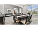 Dining room boasting a large table, comfortable seating, and ample natural light at 11002 Sundrift Dr, Tampa, FL 33647