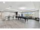 Open game room featuring a pool table, kitchenette and seating area at 11002 Sundrift Dr, Tampa, FL 33647