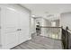 Hallway with white doors and view of spiral staircase at 11002 Sundrift Dr, Tampa, FL 33647
