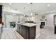 Spacious kitchen with a central island that connects to the living room and dining area at 11002 Sundrift Dr, Tampa, FL 33647