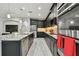 Modern kitchen features granite countertops, black cabinetry, and stainless steel appliances at 11002 Sundrift Dr, Tampa, FL 33647