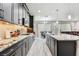 Modern kitchen featuring granite countertops, custom cabinetry and stainless steel appliances at 11002 Sundrift Dr, Tampa, FL 33647