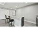 The kitchenette features granite counters, bar seating, and a modern faucet at 11002 Sundrift Dr, Tampa, FL 33647