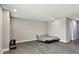 Living room showcasing laminate floors, white walls, and a murphy bed at 11002 Sundrift Dr, Tampa, FL 33647
