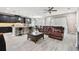 Open-concept living room with modern kitchen, sleek countertops, and stylish decor at 11002 Sundrift Dr, Tampa, FL 33647