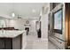 Open-concept kitchen/living room featuring stainless steel appliances and modern finishes at 11002 Sundrift Dr, Tampa, FL 33647