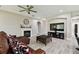 Cozy living room showcasing a fireplace, a large TV, and stylish decor at 11002 Sundrift Dr, Tampa, FL 33647