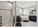 Spa-like main bathroom with separate vanities, tub, and glass-enclosed shower at 11002 Sundrift Dr, Tampa, FL 33647