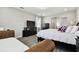 Cozy main bedroom with a sitting area and modern TV at 11002 Sundrift Dr, Tampa, FL 33647