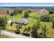 Aerial view of property showing sprawling home, screened pool, and extensive agricultural surroundings at 1109 Colson Rd, Plant City, FL 33567