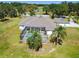Aerial shot highlights screened-in pool and surrounding lawn of this home at 1109 Colson Rd, Plant City, FL 33567