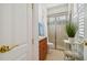 Updated bathroom with glass-enclosed shower and decorative tile accents at 1109 Colson Rd, Plant City, FL 33567