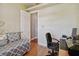 Comfortable bedroom with a twin bed, desk, and modern chair, accented by stylish decor and bright lighting at 1109 Colson Rd, Plant City, FL 33567