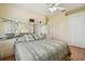 Bedroom featuring wood floors, large mirror, and closet at 1109 Colson Rd, Plant City, FL 33567