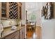 Butler's pantry and dining area with wine storage, granite counters, hardwood floors, and chandelier at 1109 Colson Rd, Plant City, FL 33567