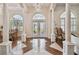 Elegant foyer with hardwood floors, a crystal chandelier, and views of the interior spaces at 1109 Colson Rd, Plant City, FL 33567