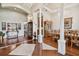 Spacious interior featuring hardwood floors, dining table, columns, and elegant furnishings at 1109 Colson Rd, Plant City, FL 33567