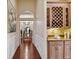 Elegant hallway with a built-in wine rack and hardwood floors at 1109 Colson Rd, Plant City, FL 33567