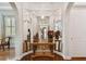 Stunning hallway with mirrored walls and arched doorways at 1109 Colson Rd, Plant City, FL 33567