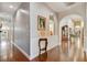 Inviting hallway with hardwood floors, arched doorways, and elegant décor at 1109 Colson Rd, Plant City, FL 33567