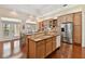 Spacious kitchen with granite countertops, wood cabinetry, and stainless steel appliances at 1109 Colson Rd, Plant City, FL 33567