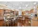 Large kitchen featuring a stainless steel refrigerator, granite countertops, and center island seating at 1109 Colson Rd, Plant City, FL 33567