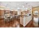 Spacious kitchen with wood cabinets, stainless steel appliances, granite countertops, and breakfast bar at 1109 Colson Rd, Plant City, FL 33567
