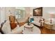 Living room with decorative furniture, large window, hardwood floors, and a painting on the wall at 1109 Colson Rd, Plant City, FL 33567