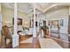 Elegant living room featuring tall columns, hardwood floors, and sophisticated decor at 1109 Colson Rd, Plant City, FL 33567